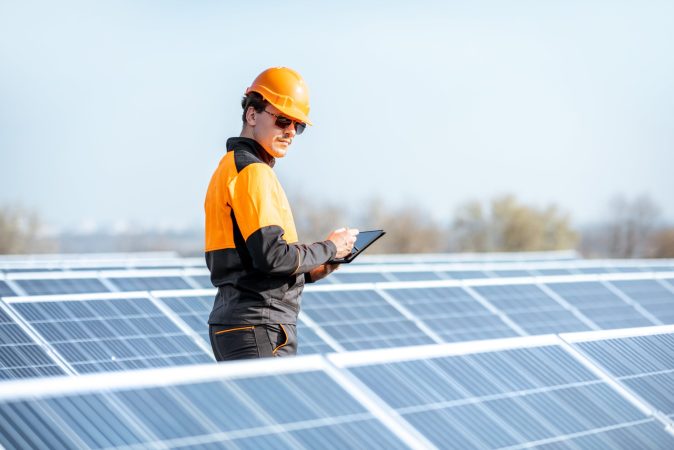 engineer-servicing-solar-panel-on-electric-plant-2022-02-01-22-36-46-utc-min