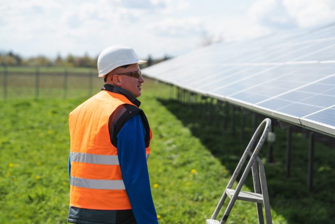 male-worker-at-solar-panels-farm-2022-01-31-18-41-38-utc-min