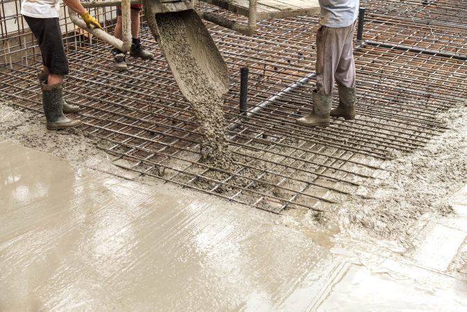 pouring-concrete-into-the-construction-of-the-hous-2022-11-16-17-26-35-utc-min